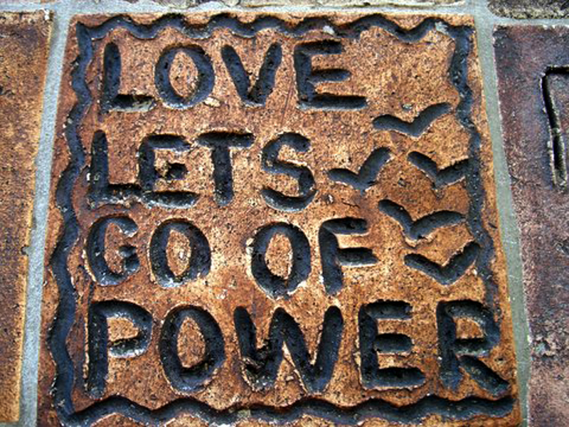 Love lets go of power, Tile from Peace Wall in Hamilton, New Zealand